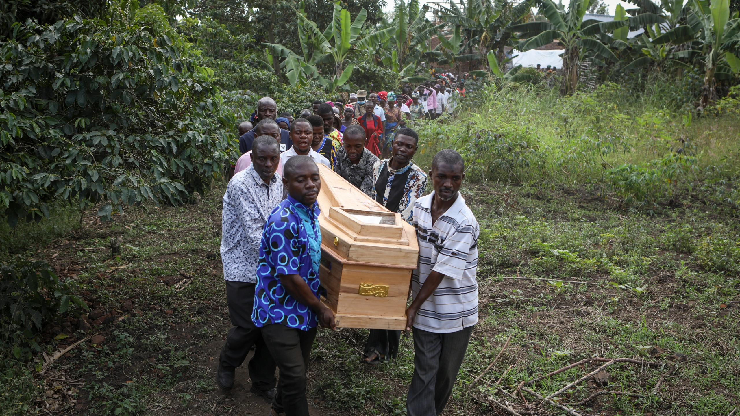 Ugandan families bury the victims of school massacre